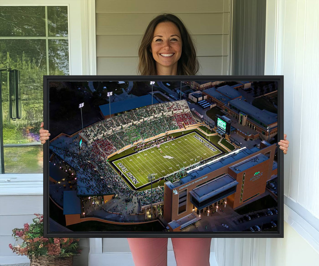 Night aerial view of fans at UNT Mean Green game captured on premium DATCU Stadium canvas wall art print.