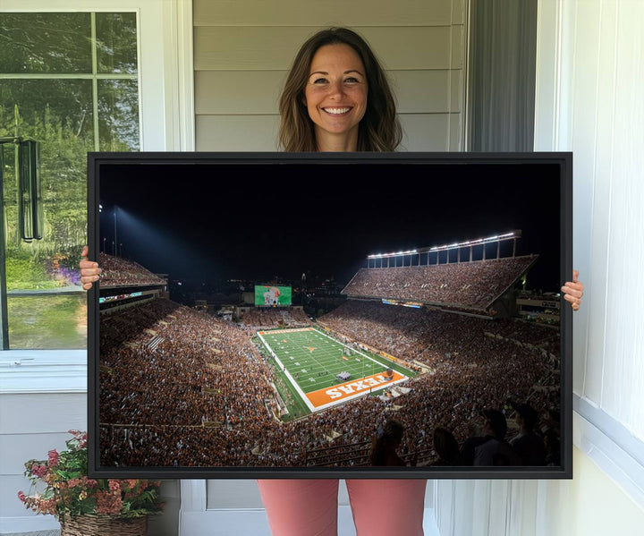A football game at a packed stadium is captured on the University of Texas Longhorns Stadium Canvas Print.