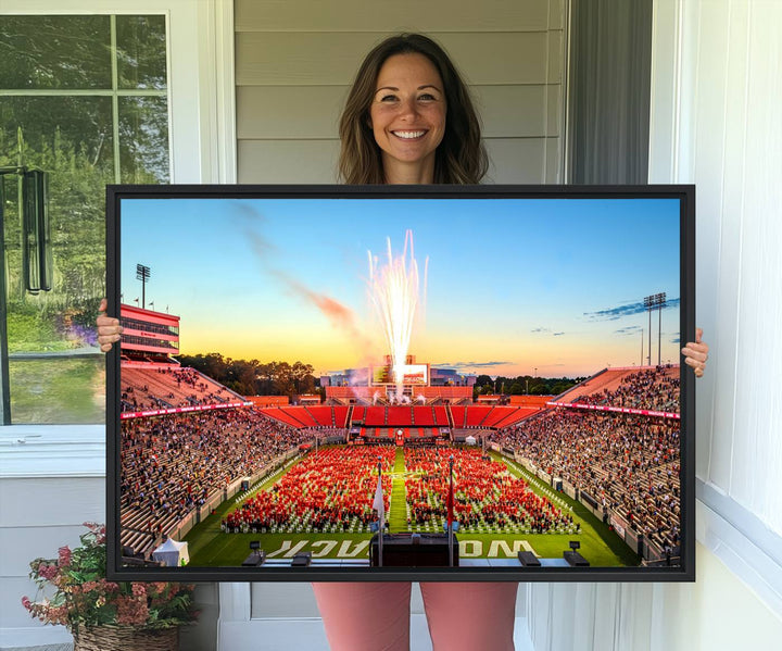 A vibrant North Carolina State University Wolfpack print, capturing a people-filled stadium, fireworks, and a sunset—perfect for your living room wall.