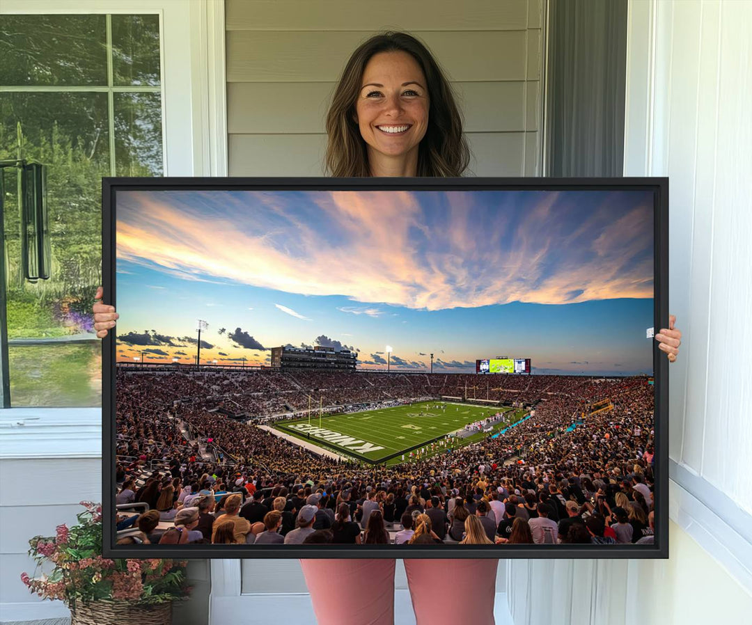 A vibrant wall art canvas captures a sunset scene at Orlandos FBC Mortgage Stadium, featuring the UCF Knights.