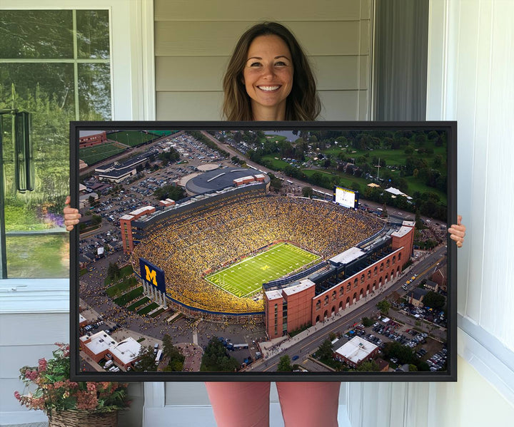 Canvas print featuring an aerial view of Ann Arbor Michigan Stadium filled with Wolverines fans.