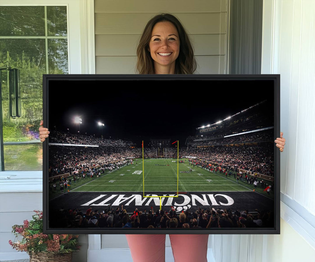 Interior view featuring a Cincinnati Bearcats football canvas of Nippert Stadium.