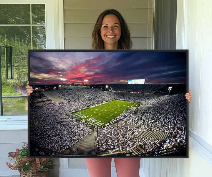 A sunset print on a canvas wall art piece captures the scene of white-clad fans at Beaver Stadium for the Nittany Lions game.