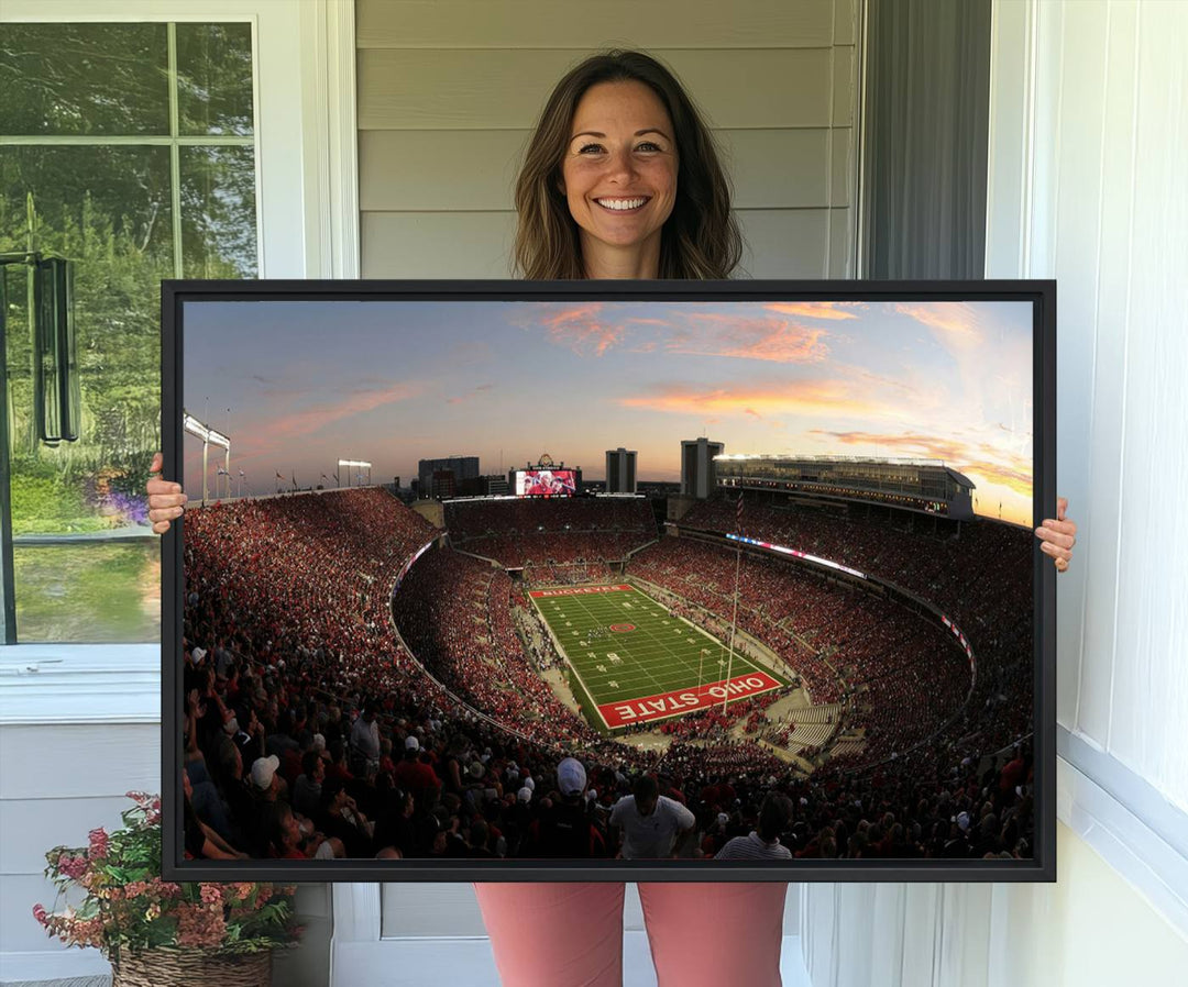 The canvas wall art captures a stunning stadium view of a sunset over Ohio State University Buckeyes football fans.