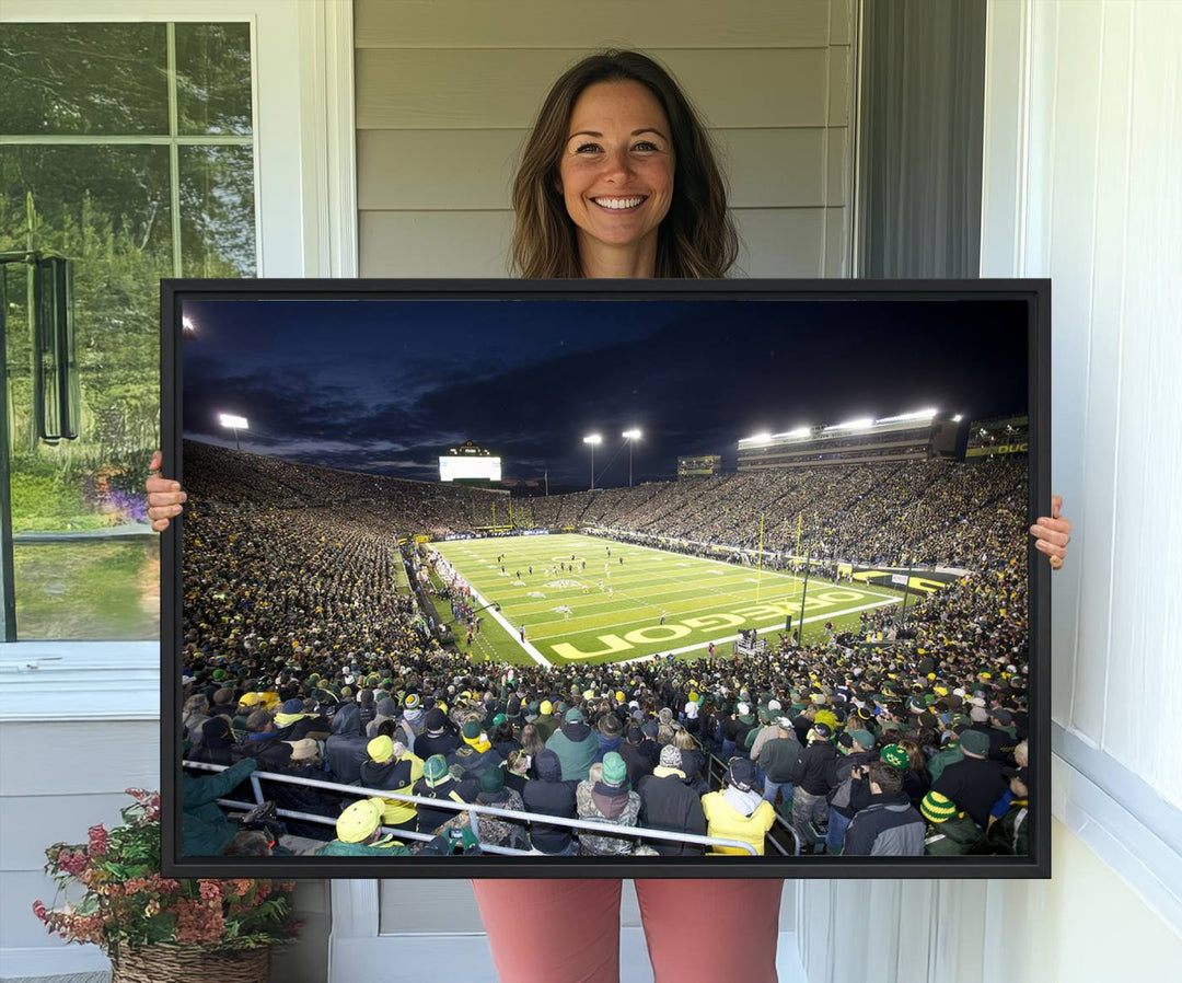 Under bright lights, a University of Oregon Ducks Canvas Print captures the excitement of fans packing Autzen Stadium for a night football game.