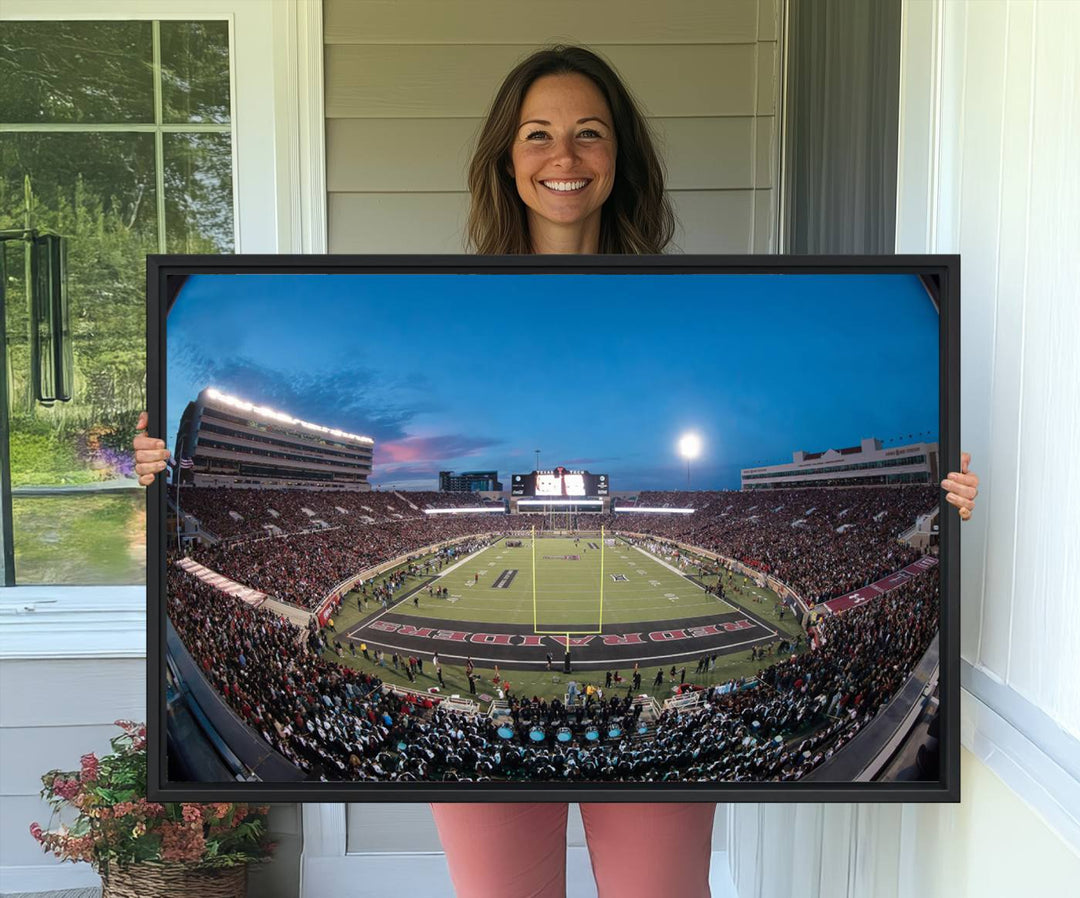 The wall art in the living room features a Texas Tech Red Raiders Football Team Print, showcasing Jones AT&T Stadium at dusk.