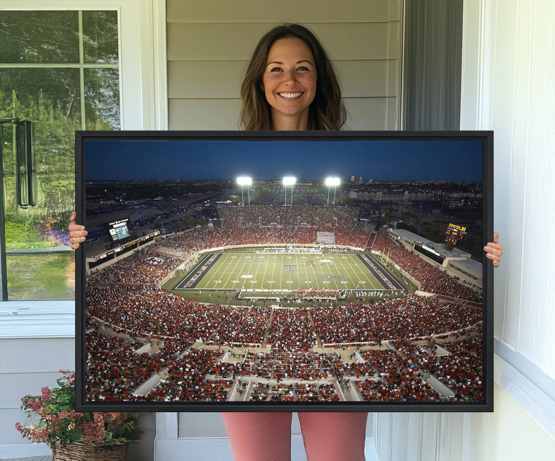 Canvas wall art featuring an aerial view of the Texas Tech Red Raiders packed night game at Lubbock’s Jones AT&T Stadium.