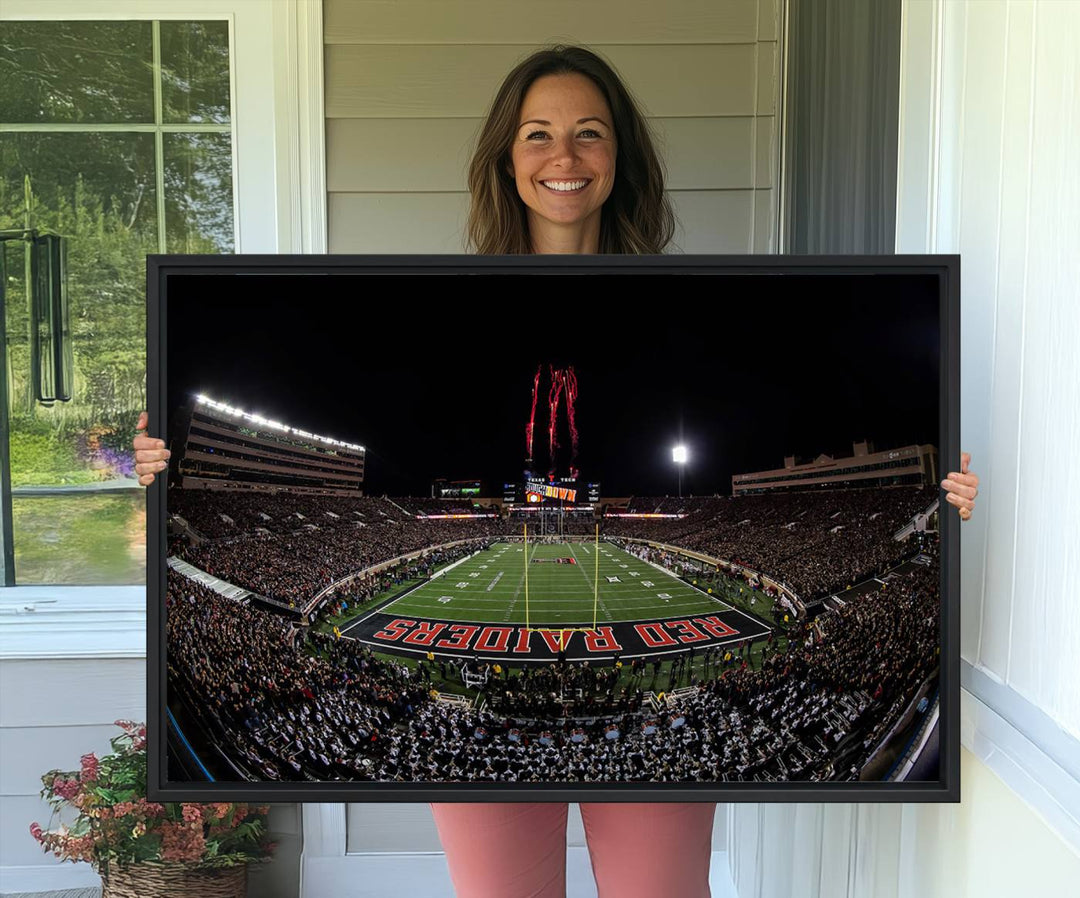 The wall features a Texas Tech Red Raiders Football Team Print on canvas, showcasing fireworks over a packed stadium at night.