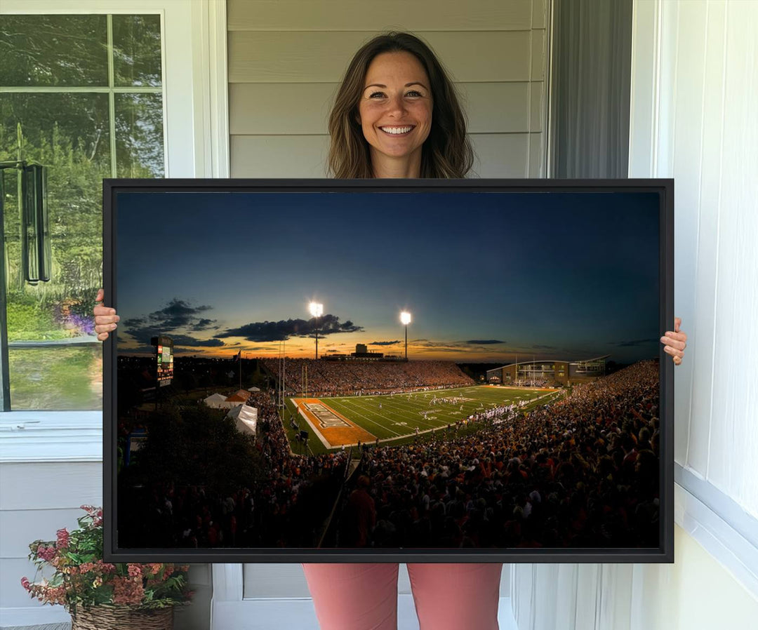 Ball State Cardinals Football Team Print - Muncie Scheumann Stadium Canvas featuring a sunset, floodlights, and lively crowd.