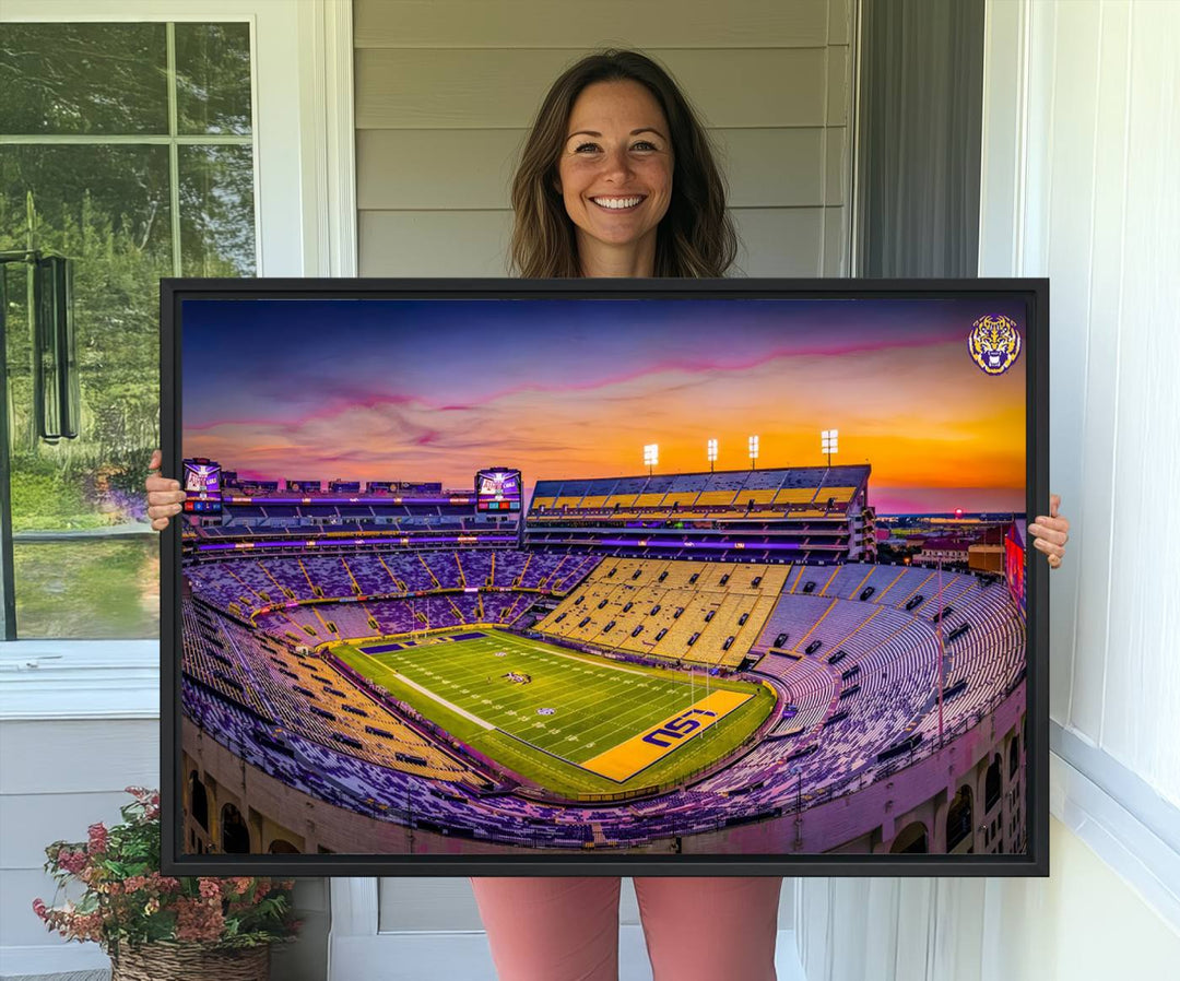 A canvas print of Tiger Stadium at sunset, depicting an empty field and stands, adorns the wall.