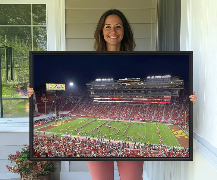 Canvas print depicting a packed stadium at night with a marching band forming USC, celebrating the Trojans at Los Angeles Memorial Coliseum.