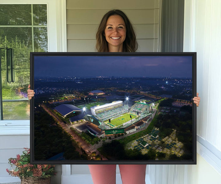 The USF Bulls Football Team Wall Art Canvas Print showcases the Tampa USF Football Stadium at night with city lights.