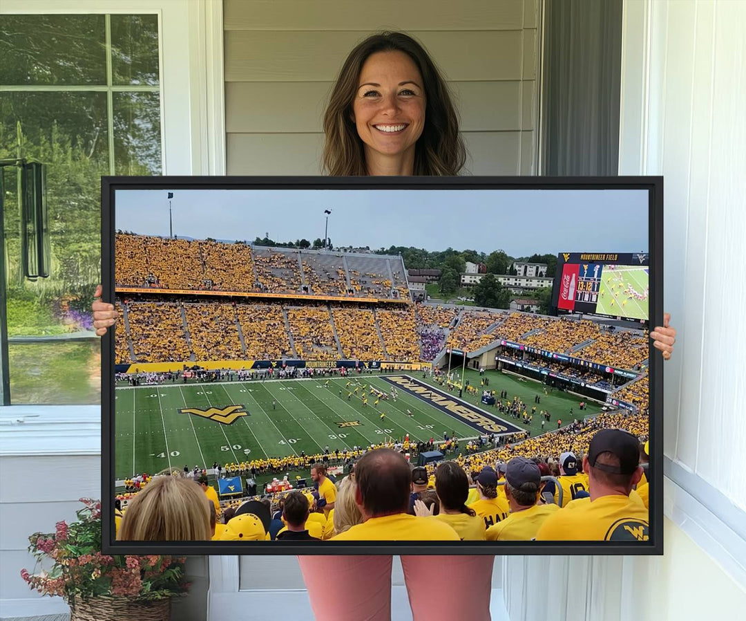 A Puskar Stadium canvas print decorates the modern living room shelf.