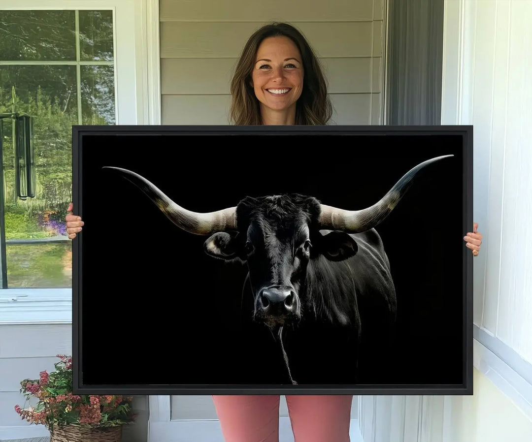 The Texas Black Longhorn Bull Canvas Print, featuring large curved horns set against a dark background, is ideal for Western decor.