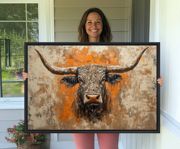 Abstract Cow Longhorn Bull Wall Art presents a detailed face centered on a textured orange and beige background.