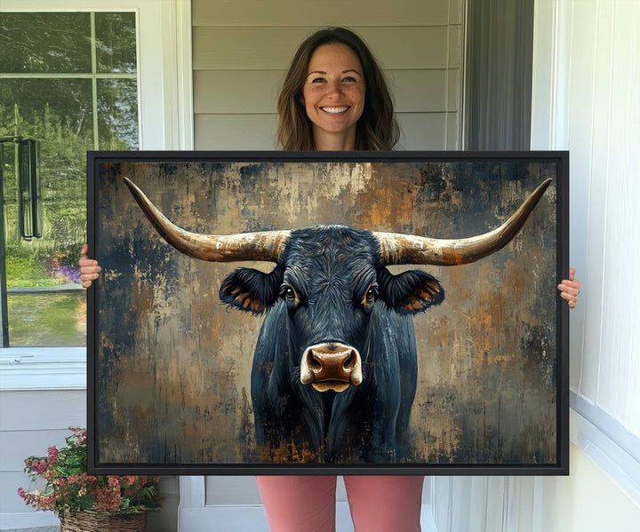 The Texas Western Wall Art Canvas Print showcases a Longhorn Bull set against an abstract brown and gray backdrop, making it perfect for rustic decor.