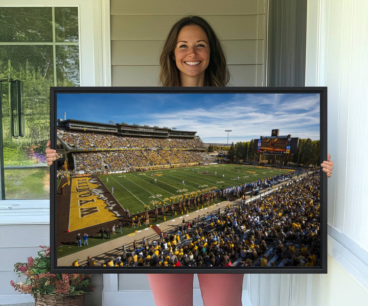 Canvas Wall Art Print: University of Wyoming Cowboys action at Jonah Field War Memorial Stadium under a sunny blue sky.