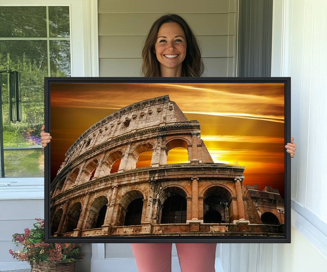 On the wall, theres a piece of art titled Colosseum with Yellow Sunset Behind, Italy.