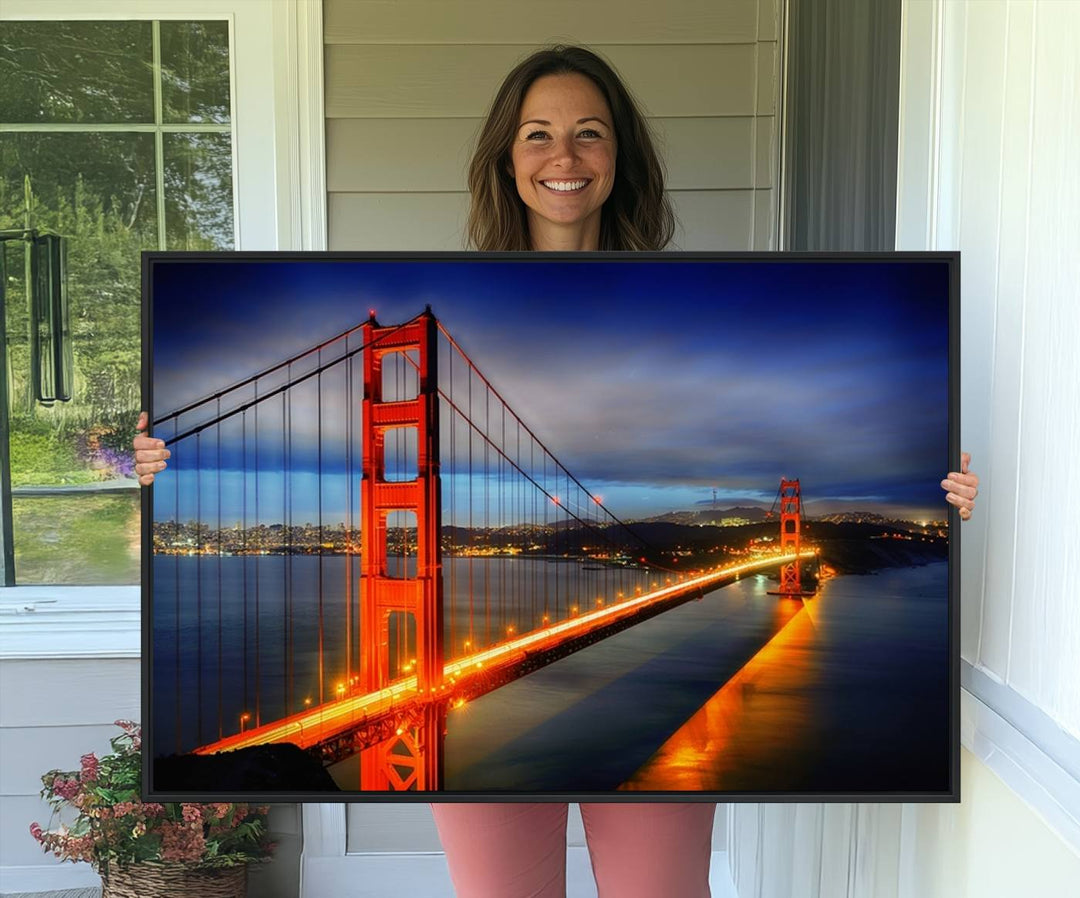 A large wall art San Francisco canvas print of the Golden Gate Bridge at twilight is displayed on a porch.