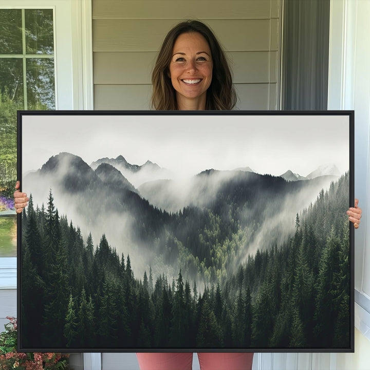 The Misty Forest Canvas Print Wall Art captures a serene misty forest scene with fog and mountains.