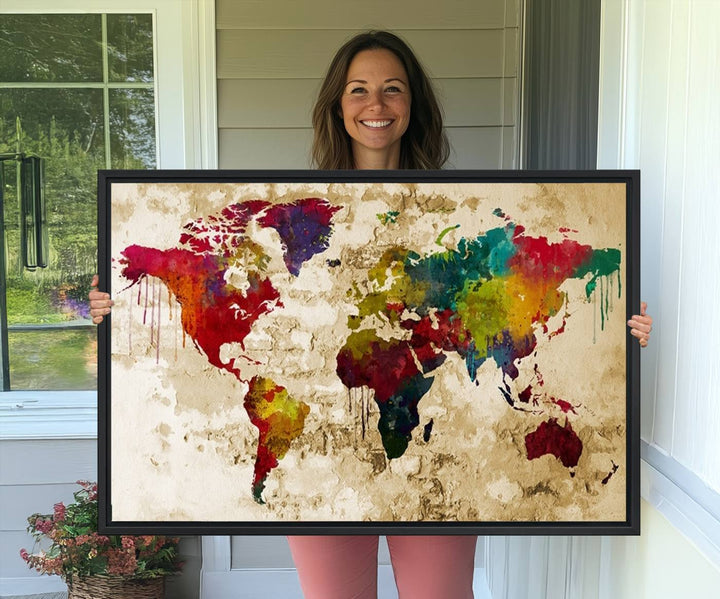 The Rainbow Colored Vintage World Map Canvas Print decorates the room.