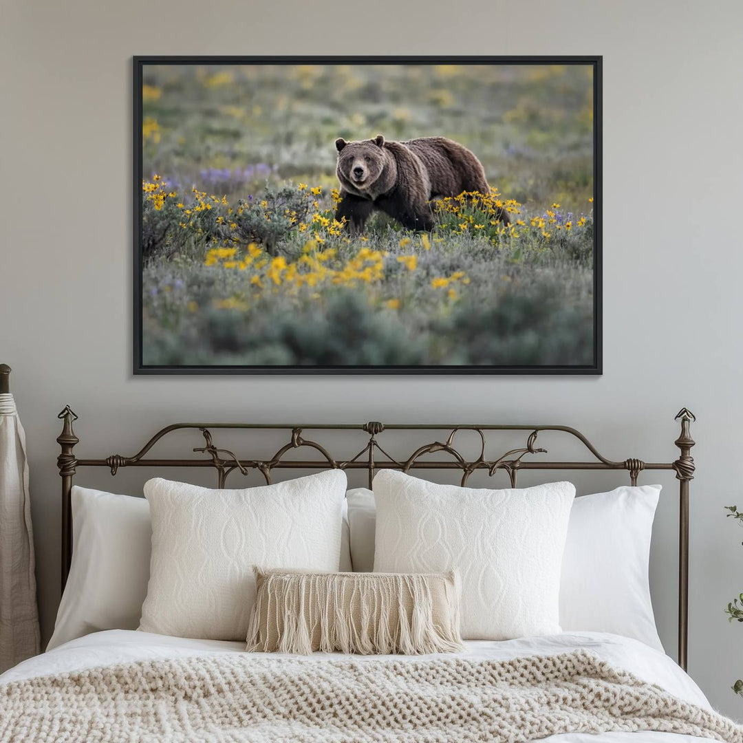 The "Grizzly 399 in Wild Flowers Wall Art Canvas Print" features a grizzly bear strolling through a field of yellow and purple flowers, beautifully showcased as a triptych. This handcrafted piece, proudly made in the USA, adds charm and sophistication to your space.