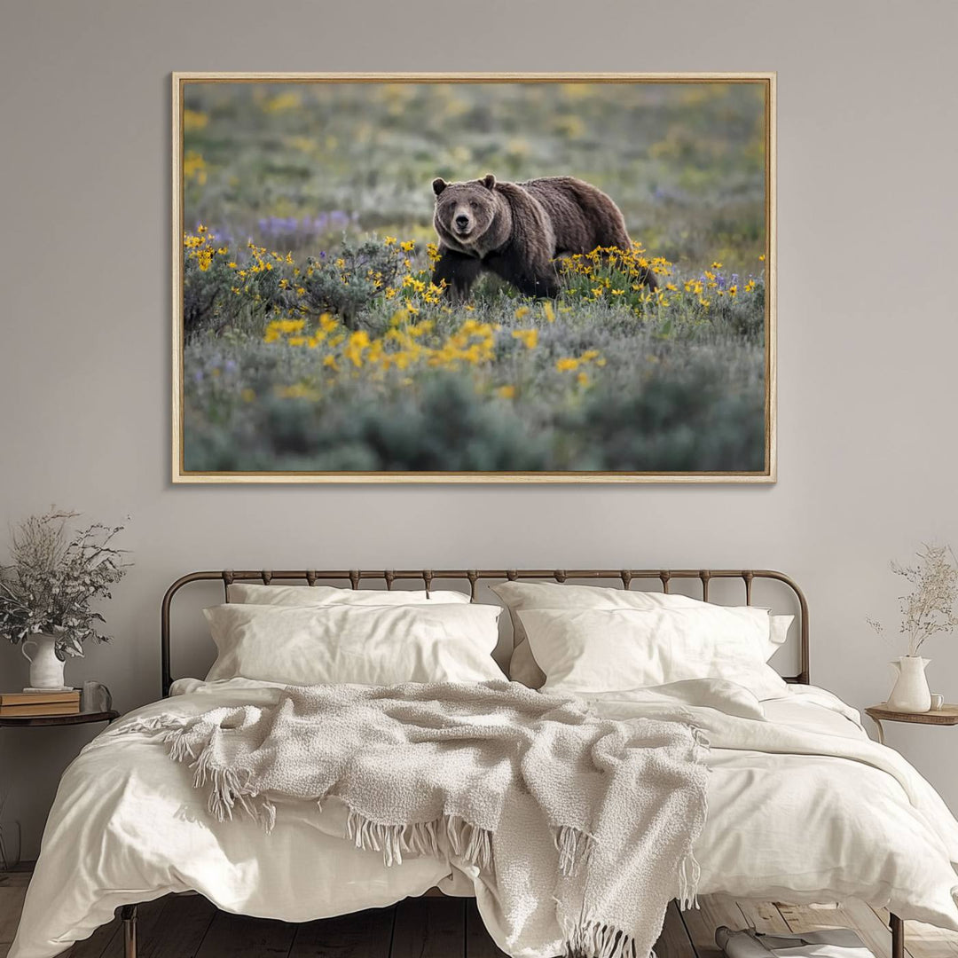 The "Grizzly 399 in Wild Flowers Wall Art Canvas Print" features a grizzly bear strolling through a field of yellow and purple flowers, beautifully showcased as a triptych. This handcrafted piece, proudly made in the USA, adds charm and sophistication to your space.