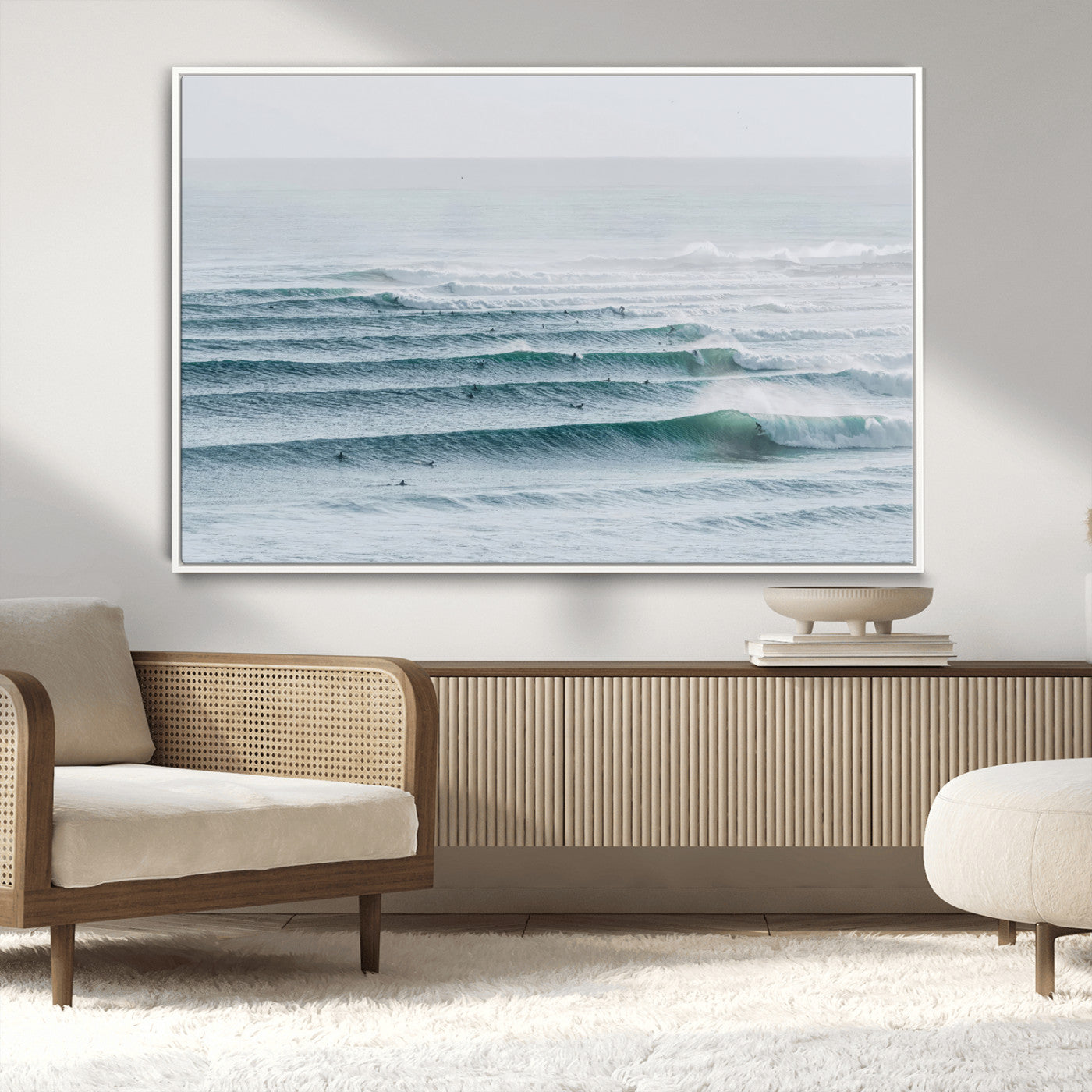High-angle view of surfers lining up across layered ocean waves, ideal for minimal coastal or surf-inspired room decor.
