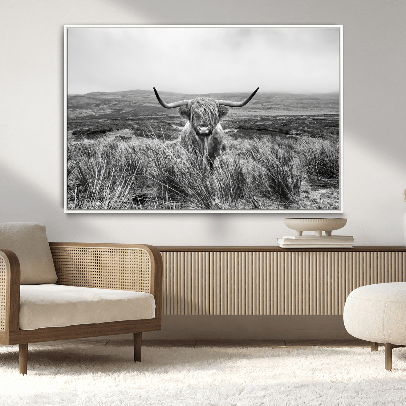 A black and white portrait of a Highland cow in a foggy Scottish countryside, capturing a rustic aesthetic and tranquil farm escape.