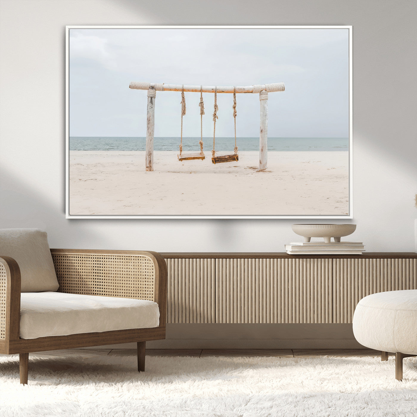 A rustic wooden beach swing stands on a serene sandy shore with an ocean horizon in the background, creating a tranquil and dreamy coastal escape.