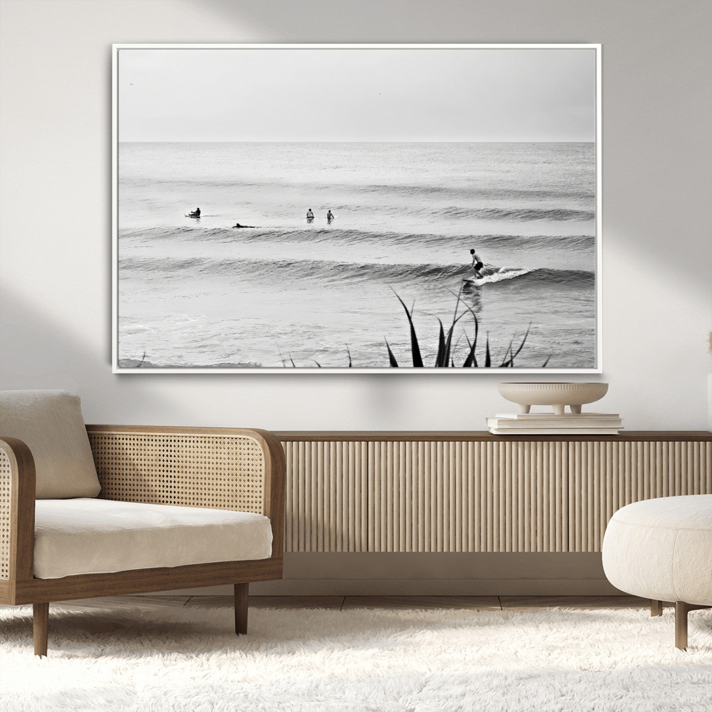 Monochrome canvas of surfers on calm ocean waves, ideal for minimalist coastal or beach-inspired interior decor.