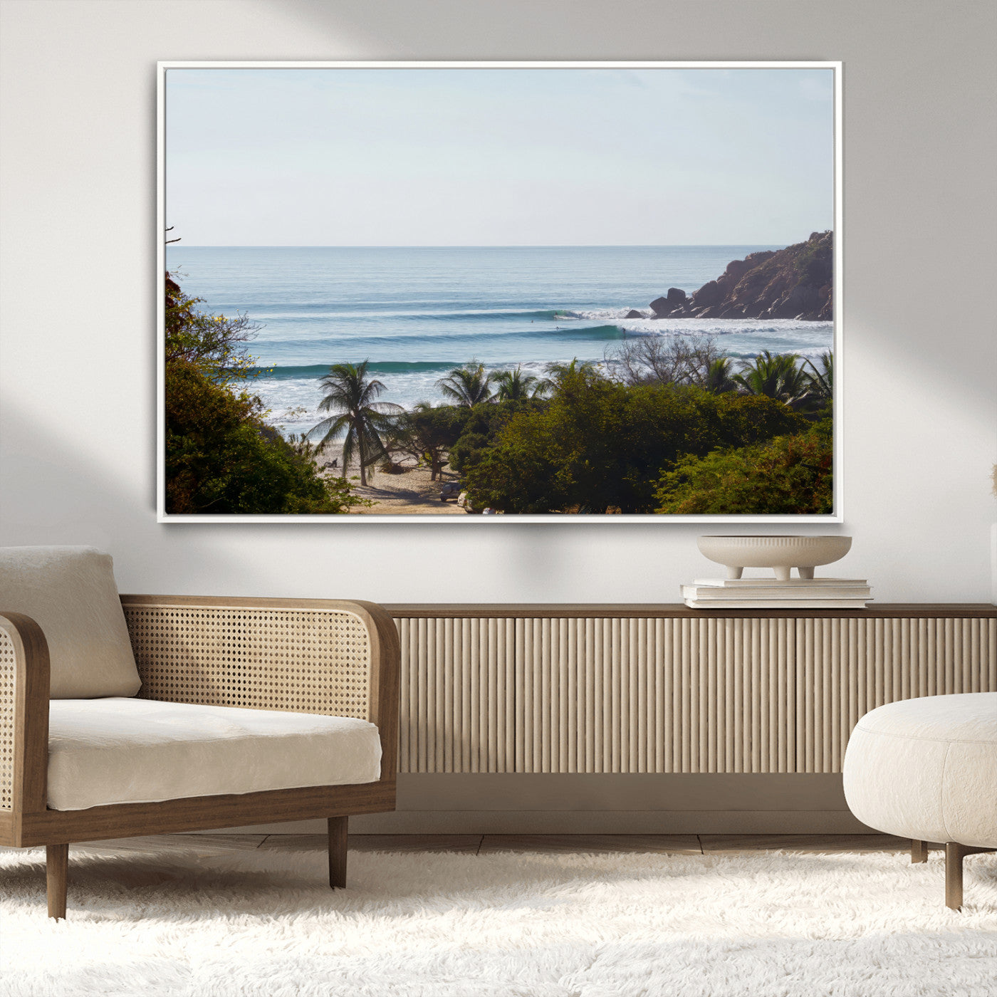 View of calm ocean waves with palm trees and a tropical coastline, ideal for coastal boho or beach-themed wall decor.