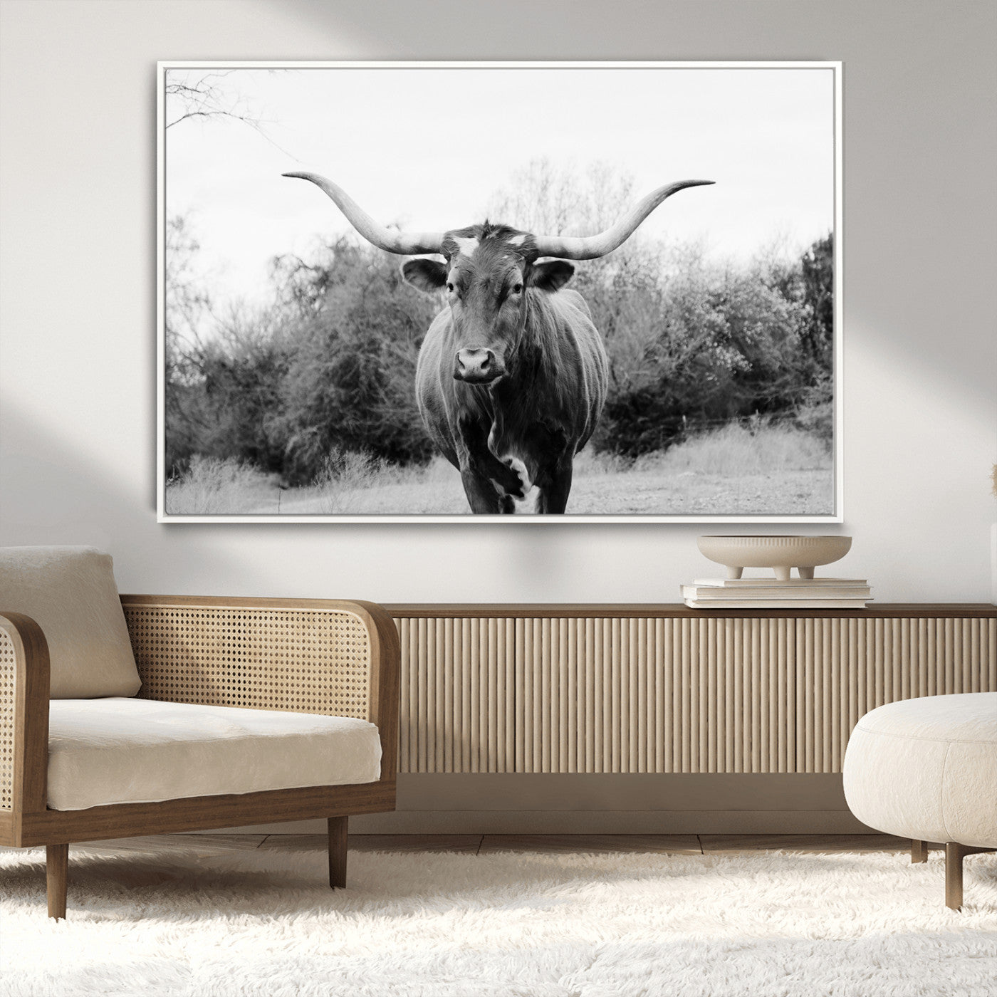 Black and white photo of a Longhorn cow facing camera, ideal for rustic, farmhouse, or western-themed home wall decor.
