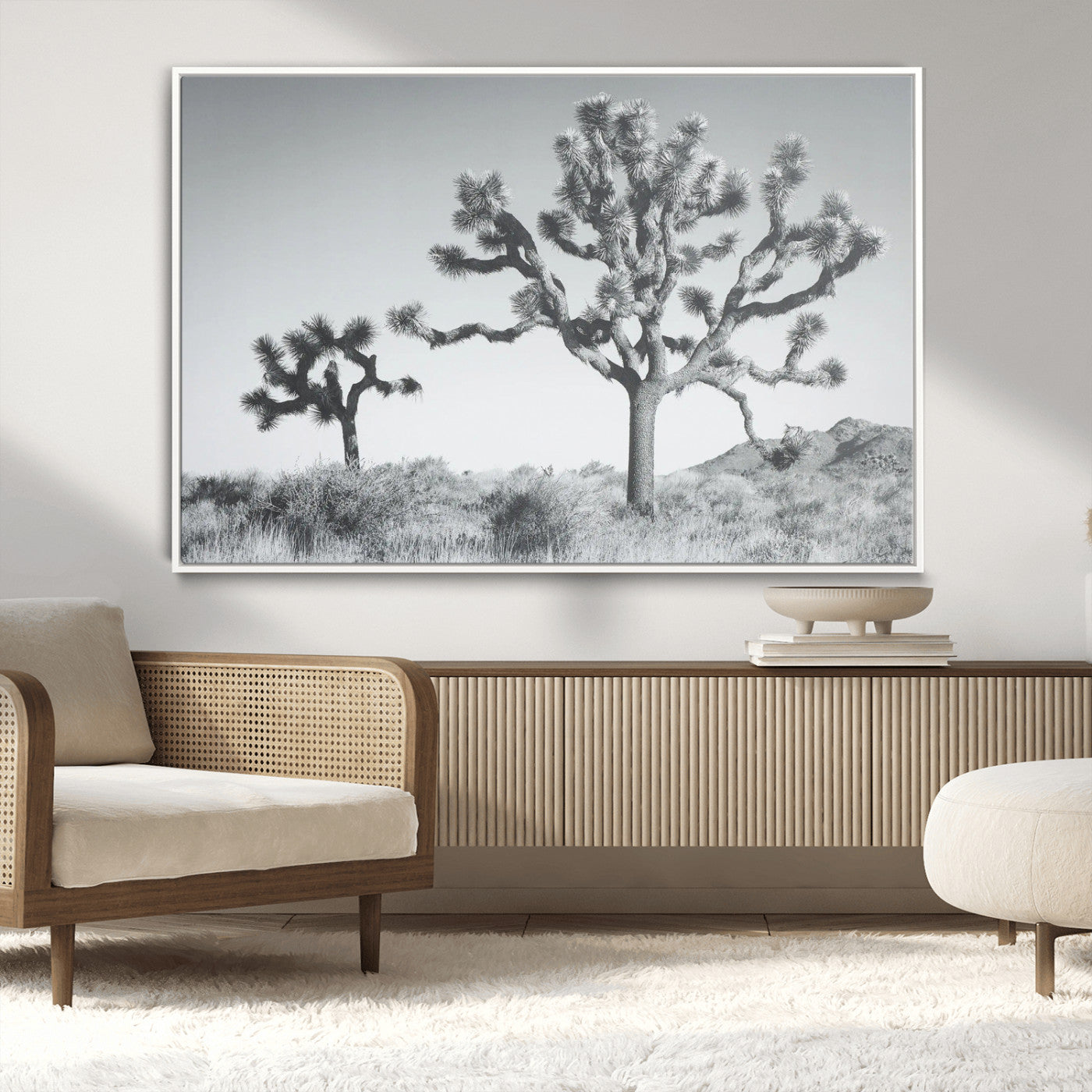 Two Joshua trees in a black and white desert landscape with distant hills, ideal for boho or rustic interior wall styling.