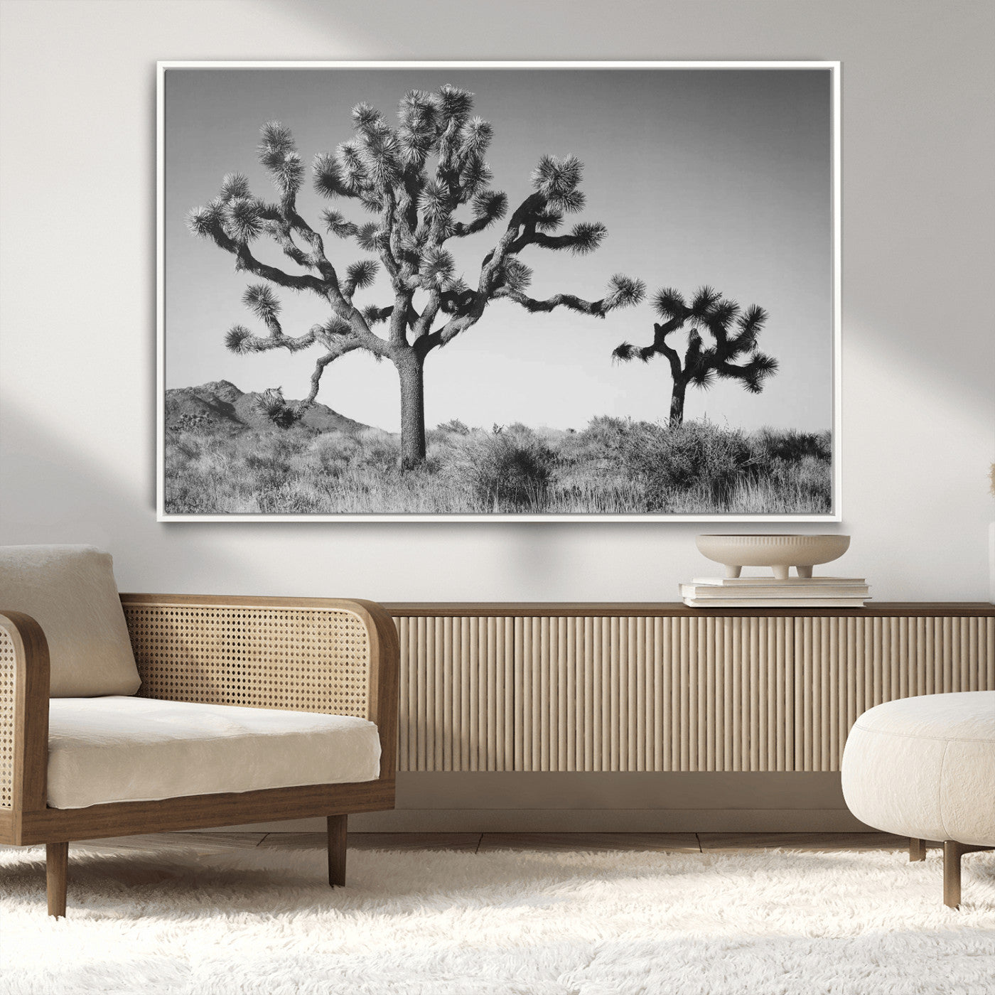 Black and white desert scene with two Joshua trees under clear sky, perfect for rustic or boho-inspired home decor.