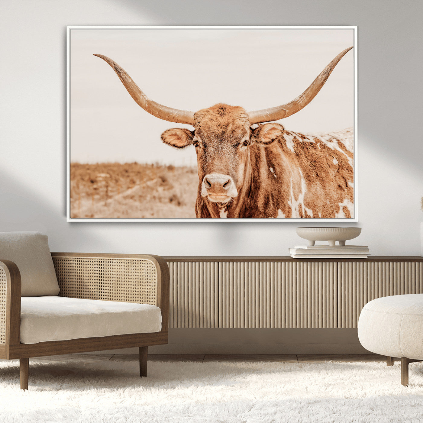 A longhorn bull standing proudly in a sunlit desert field with warm neutral tones, ideal for rustic western or farmhouse interiors.