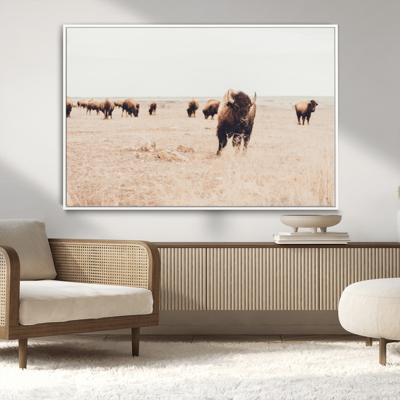 Herd of bison roaming a vast prairie with golden grass under a soft sky, creating a rustic and Western landscape, ideal for wall art.