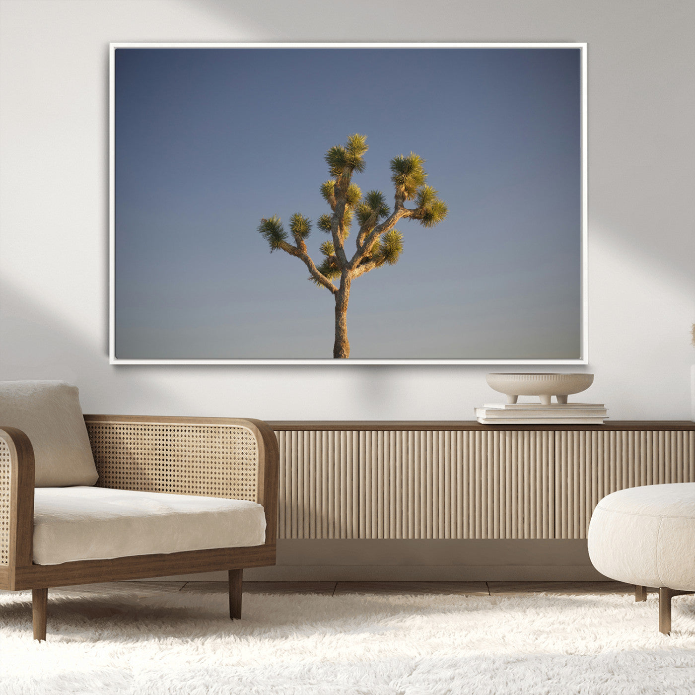 A lone Joshua Tree standing against a deep blue sky, capturing the serene and rugged beauty of the Southwestern desert landscape.