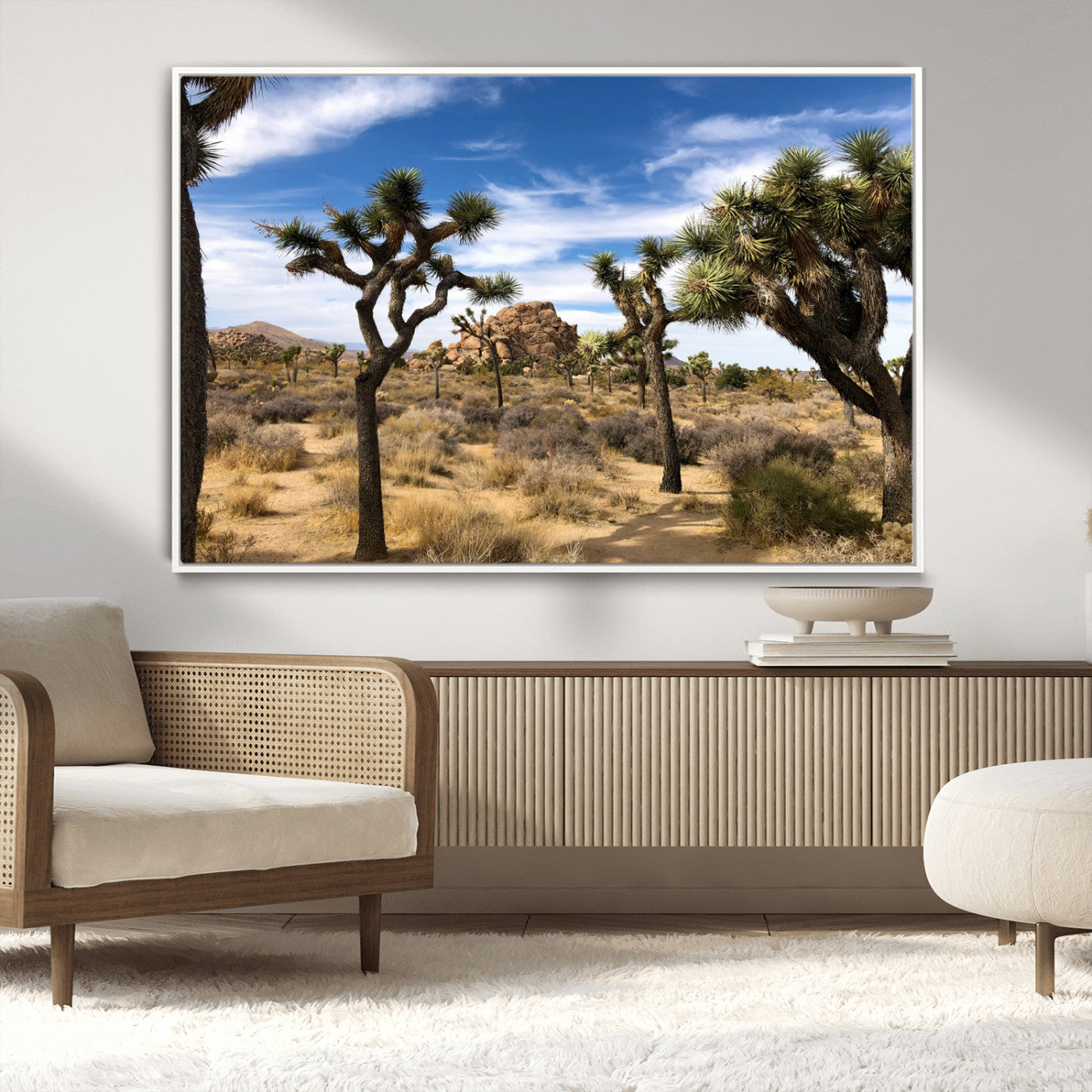 Scenic Joshua Tree landscape with rugged desert terrain, golden dry grass, and a deep blue sky, creating a warm, rustic Southwestern aesthetic.