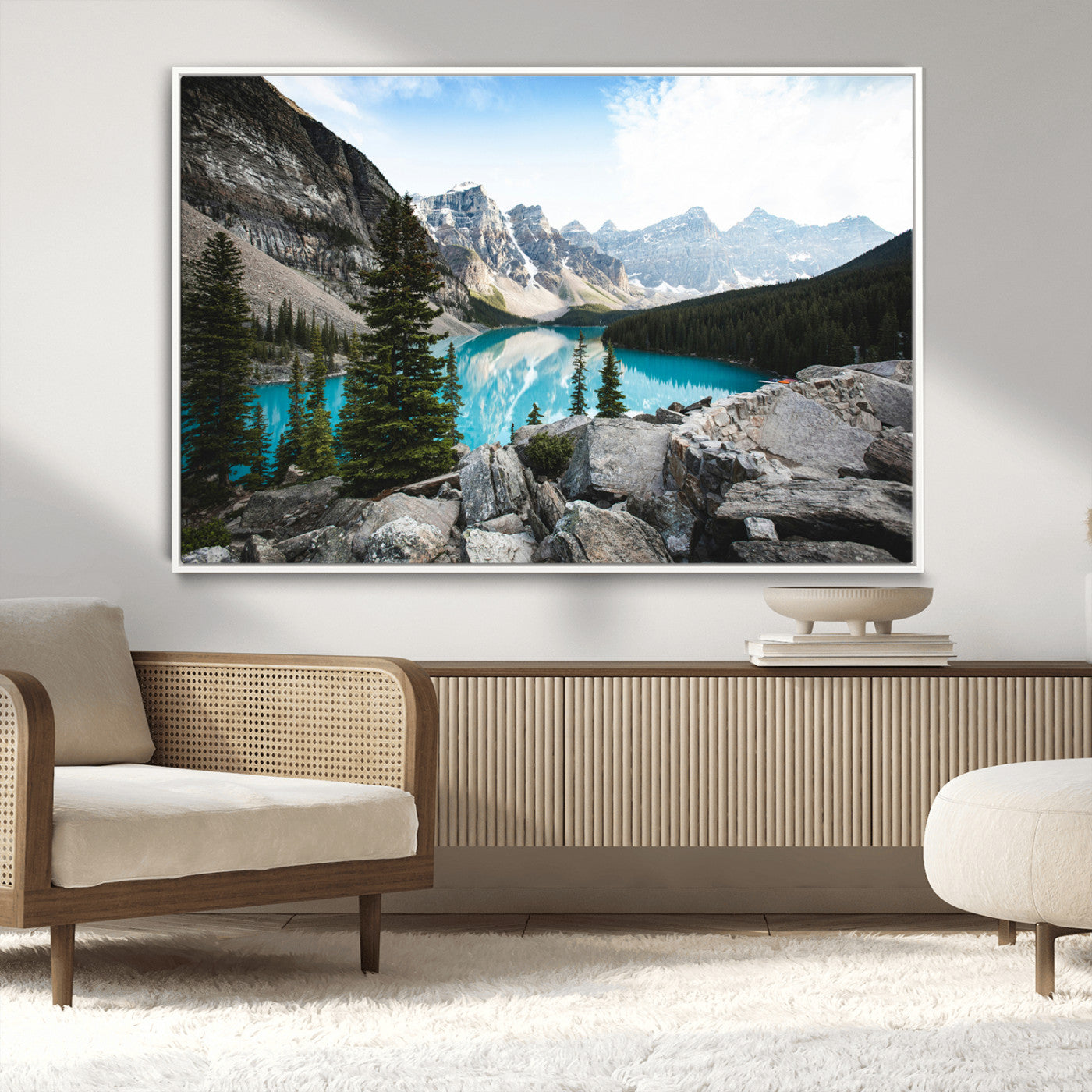 Stunning view of Moraine Lake with turquoise waters reflecting snow-capped mountains and evergreen trees, creating a peaceful alpine decor.