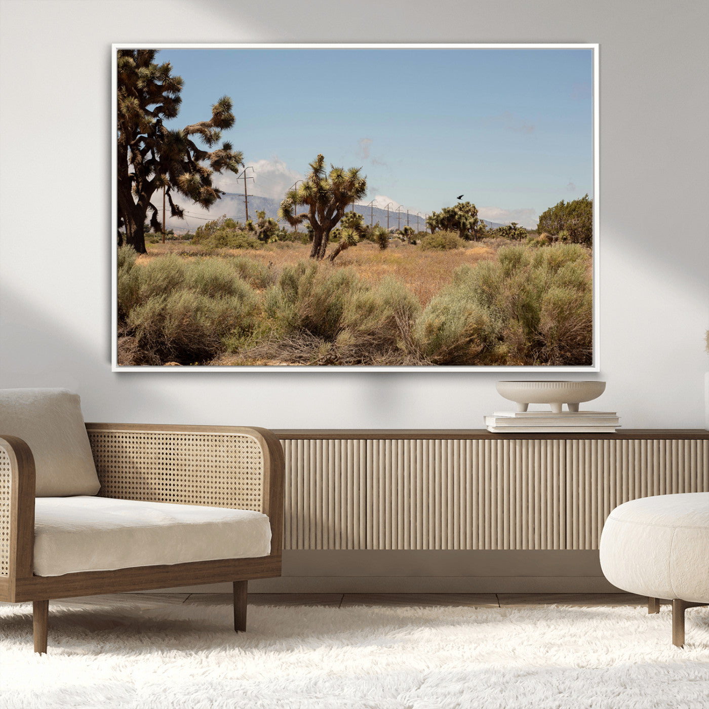 Scenic desert landscape with Joshua trees, dry grass, and distant mountains under a clear blue sky, perfect for southwestern and rustic decor.