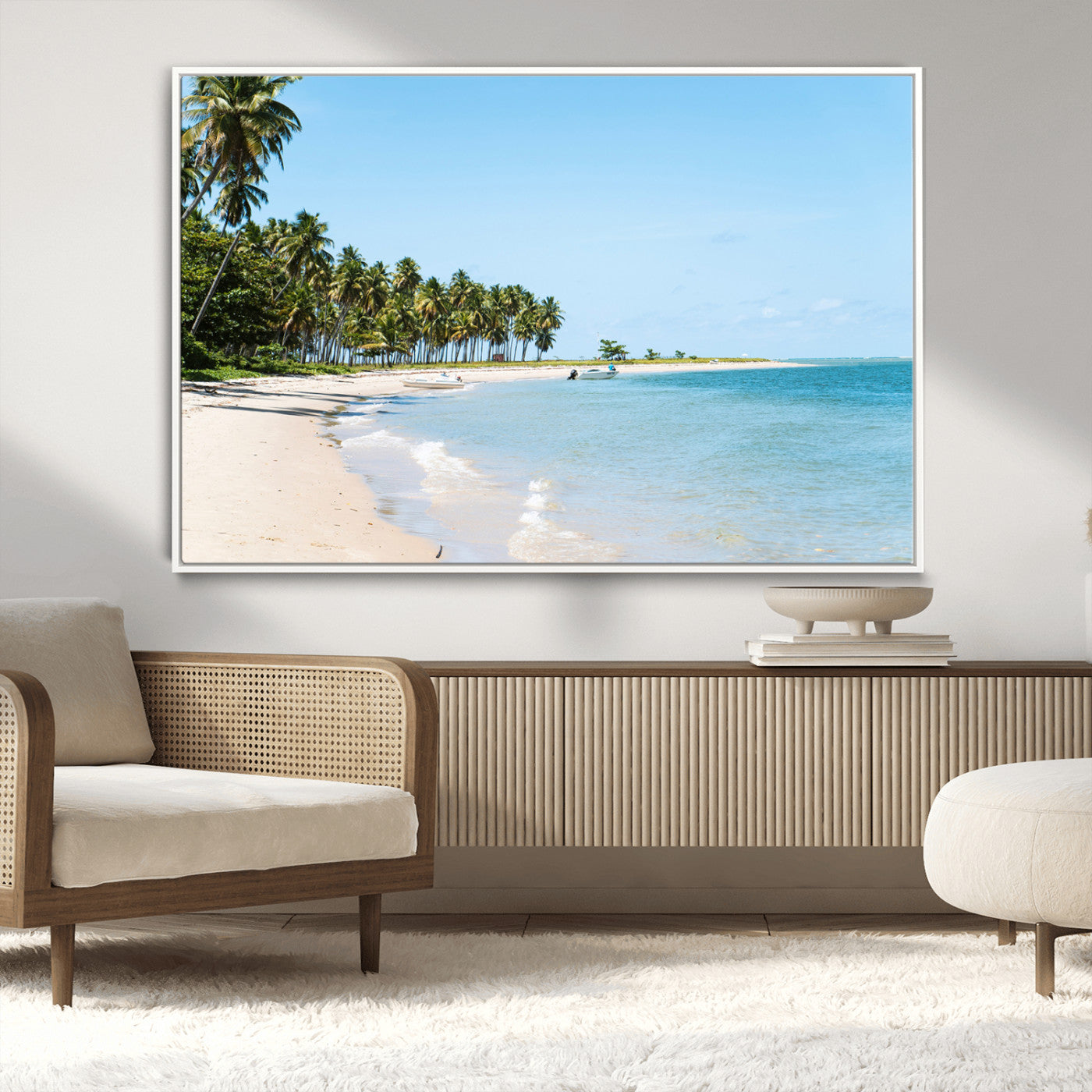 A serene tropical beach with clear blue water, soft sand, and lush palm trees under a bright sky, creating a peaceful island paradise atmosphere.
