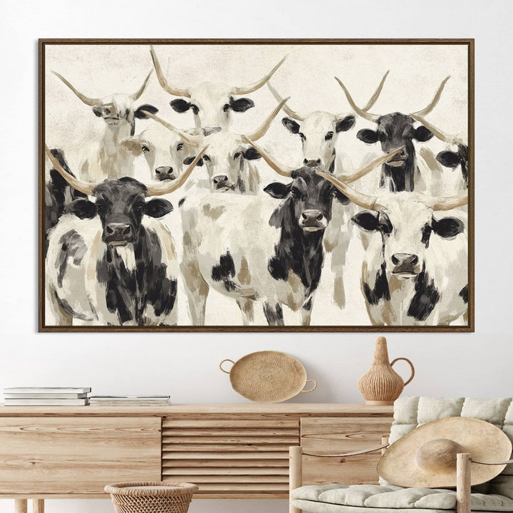 Canvas print titled Longhorn Texas Cow Drawing, depicting longhorn cattle with black and white markings, made in the USA, displayed on the wall.