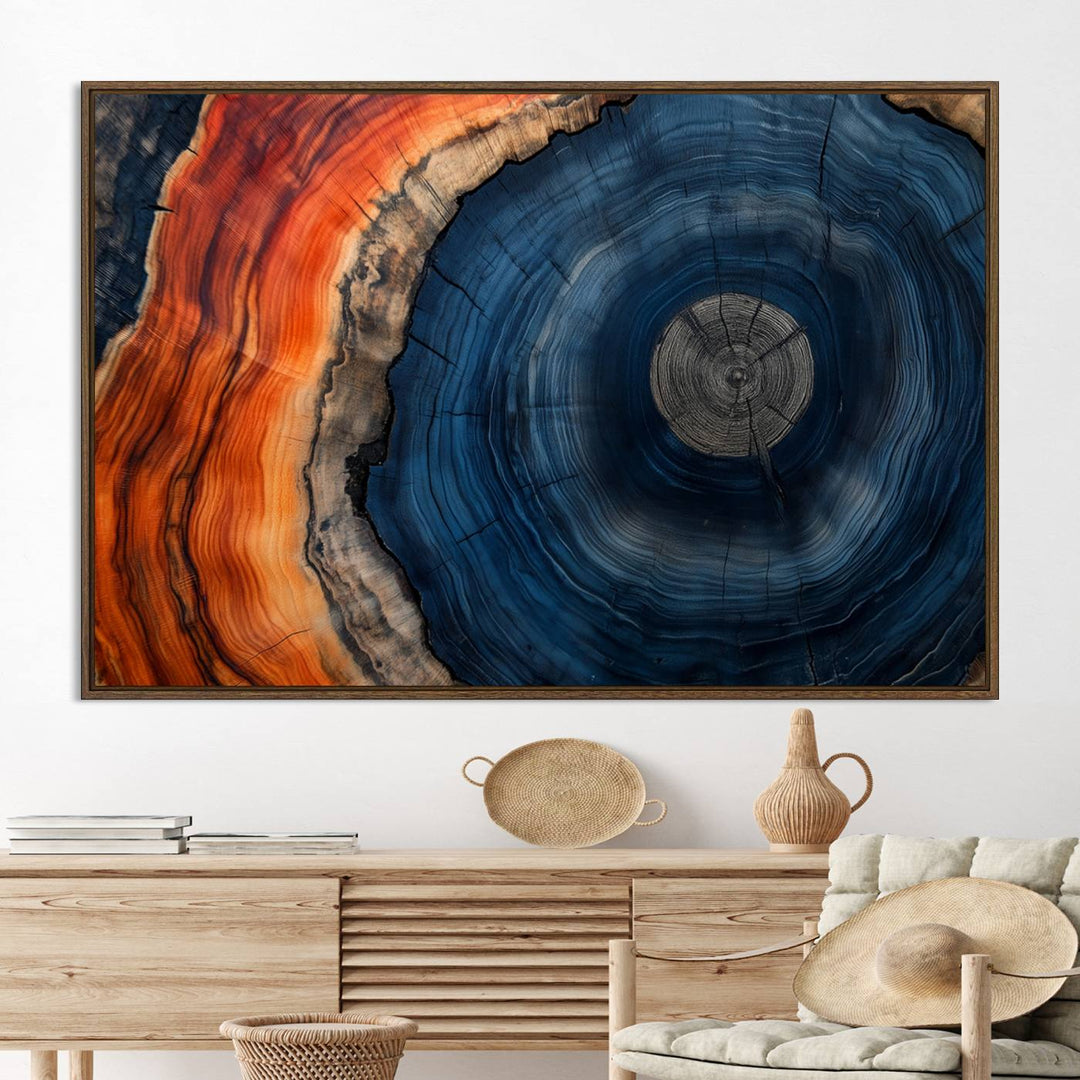 Abstract Tree Ring Wall Art Print on canvas featuring vibrant blue, orange, and brown rings with a natural rustic wood texture. Free shipping available!.