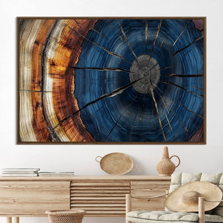 The Abstract Tree Rings Canvas Print features blue, brown, and orange rings that highlight wood grain and natures beauty.