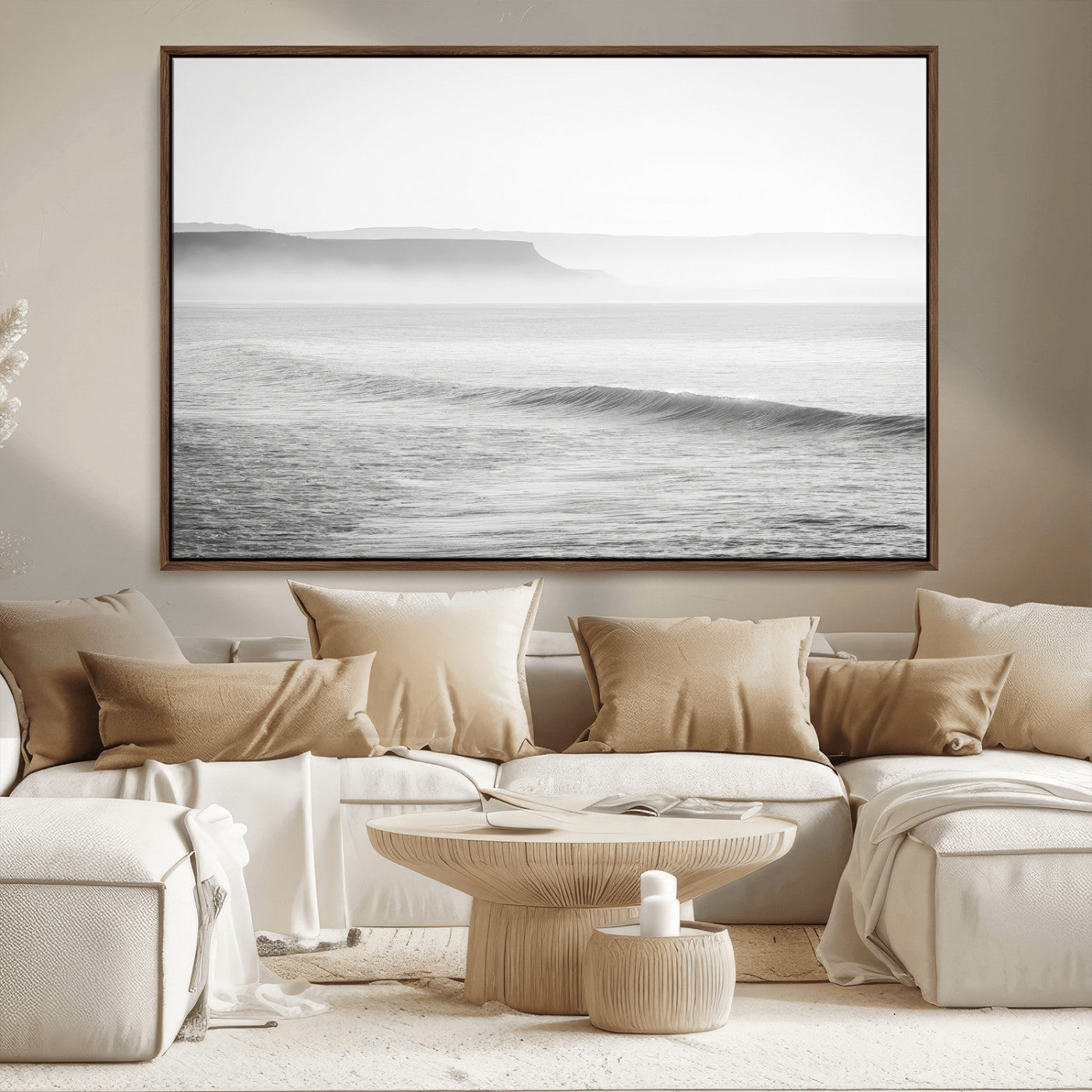 A black and white minimalist seascape featuring soft rolling waves and misty distant cliffs, creating a serene and timeless coastal atmosphere.