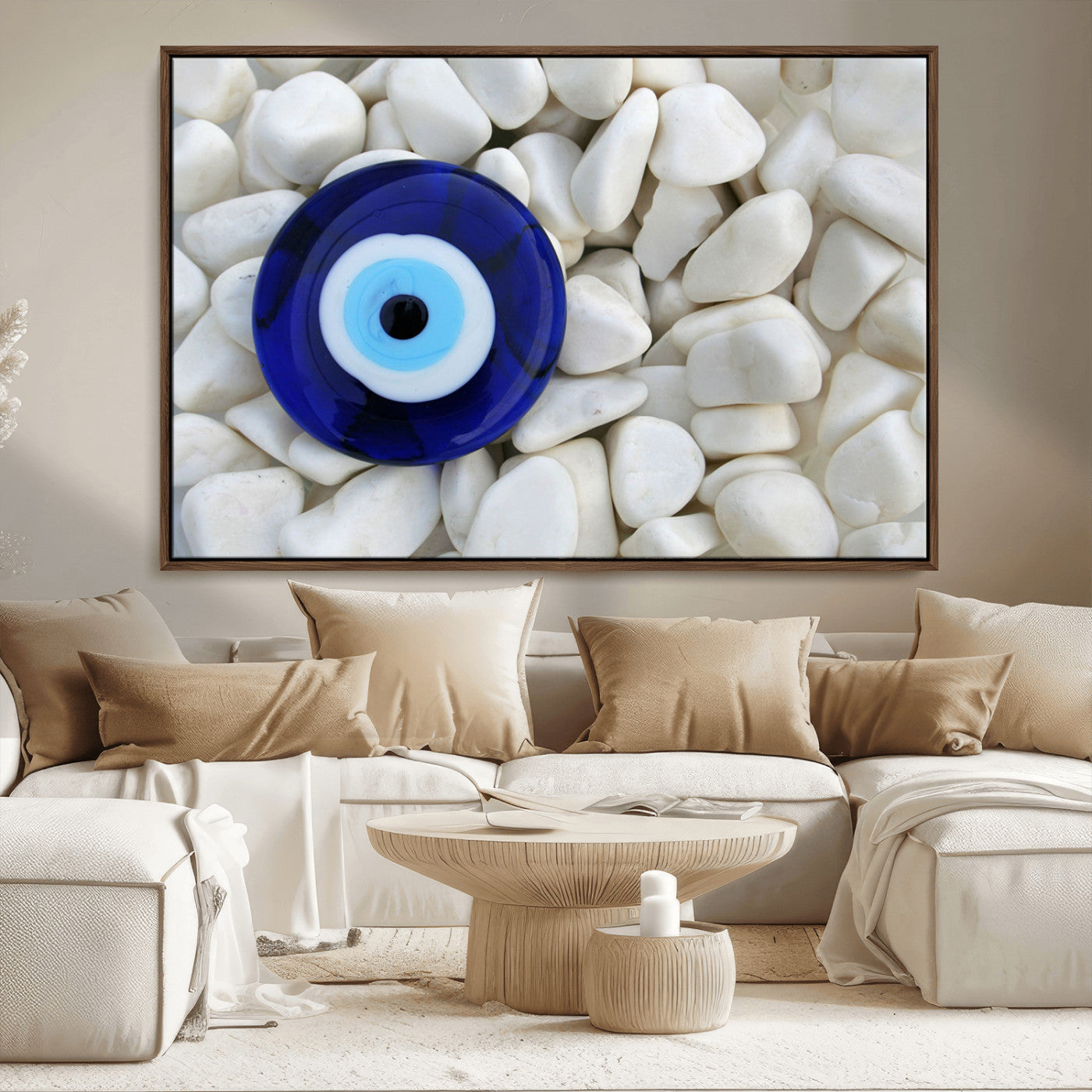 A close-up of a blue evil eye charm placed on white pebbles, symbolizing protection and good luck.