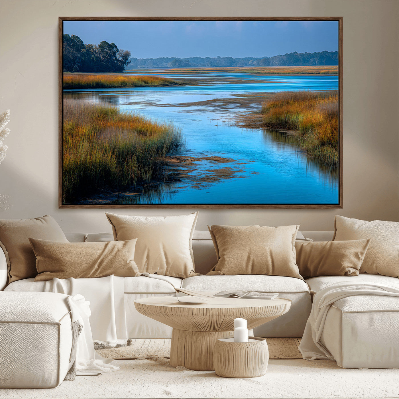 A peaceful marshland scene with calm blue water reflecting the surrounding grasses and trees, capturing the beauty of nature in a serene landscape.