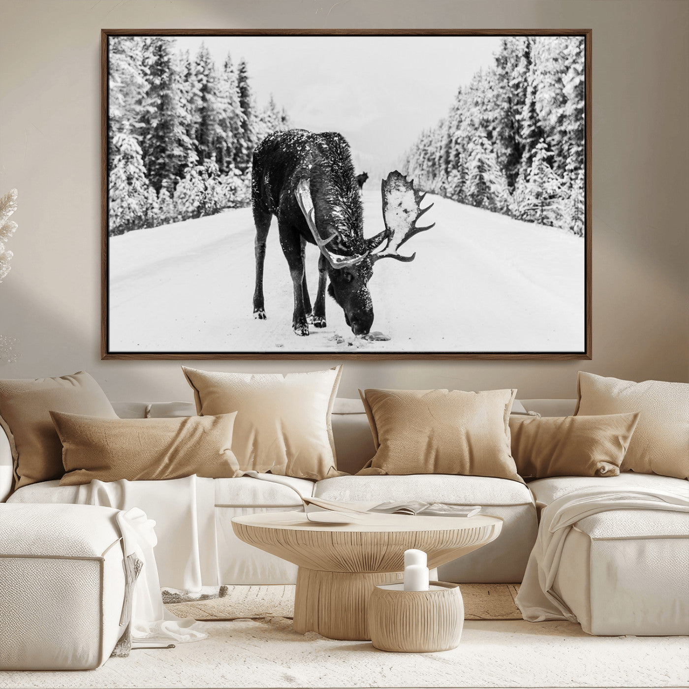 A majestic moose grazing in the snow-covered wilderness, surrounded by snow-covered trees, creating a peaceful winter scene.