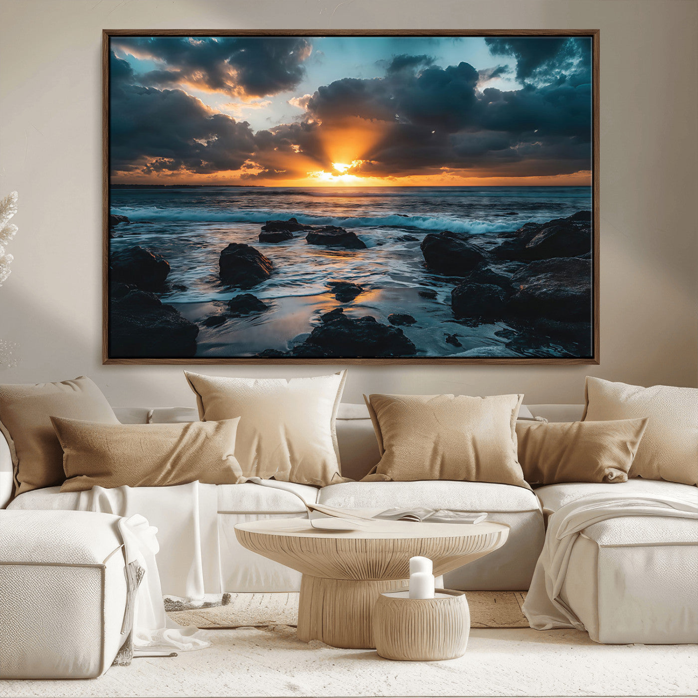 An awe-inspiring sunset over the ocean with rays of light piercing through dramatic clouds, creating a beautiful seascape with rocks in the foreground.